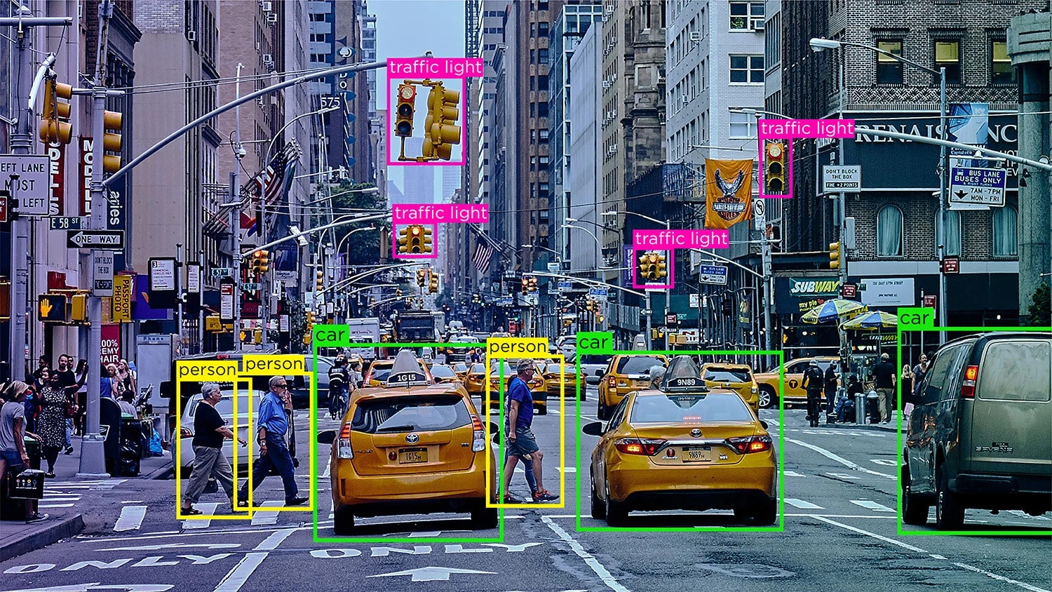 Vehicles moving through a city intersection